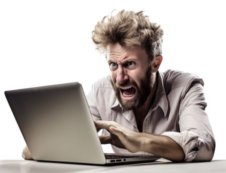 a employee reacts angrily to an issue on his laptop