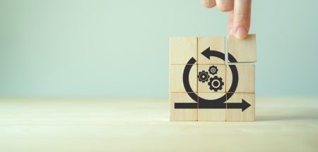 concept picture showing operational resilience - it depicts fingers adding the final block of the operational resilience jigsaw.