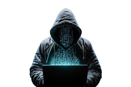 a faceless hacker works on code on a laptop