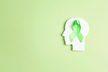 A framework for fostering mental health resilience in the workplace Mental health resilience: a white head over-laid with the green ribbon which symbolises mental health awareness