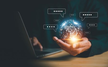 Trust, ethical, and skills issues create genAI barriers for organizations Concept picture showing generative AI - a hand holds a globe with a networks of intelligent information threads...