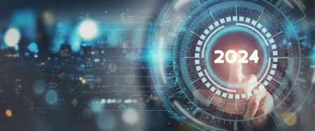 High availability in 2024 - a finger is about to press the 2024 button on a background of technology imagery.