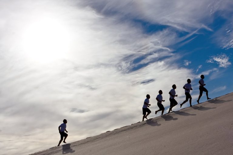 Behind left behind is one of the top business risks associated with GenAI - the picture shows a runner lagging behind in a race.