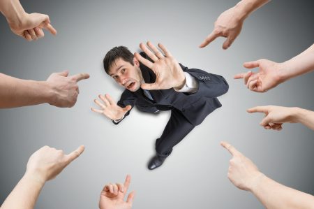 Data breaches: why the blame game adds to the impacts Many hands are pointing and blame stressed man.