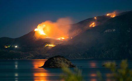 EU takes proactive measures for the 2024 wildfire season Raging Forest Fire at Night in Zakynthos, Greece.