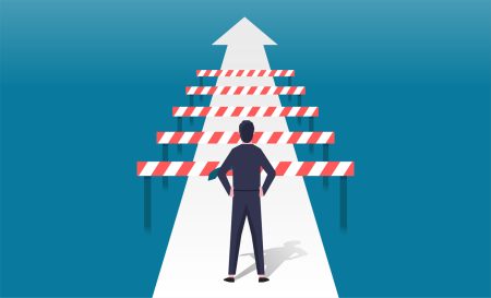 New KPMG report provides a look at the top three current business risks A person looks at a number of barriers in their way.