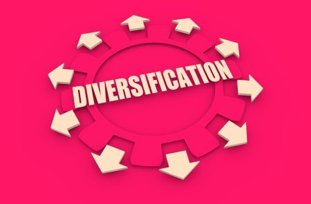 Four ways for companies to strengthen supply chain resilience A number of arrows emerge from a cog with the word diversification running through the middle.