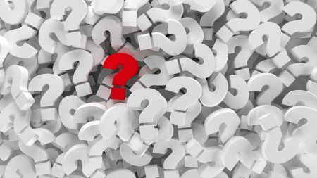 Managing uncertainty: questions for decision-makers to ask in an uncertain environment A pile of white question marks with one priority one standing out in red - showing the concept of managing uncertainty.
