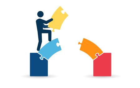 UK businesses strengthen cyber resilience but people and governance gaps remain Bridging the gap - a stick figure holds a block which will complete a bridge between two key areas.