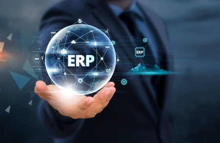 Research quantifies the business impact of enterprise resource planning downtime A businessman holds global business globe with network connected to ERP System