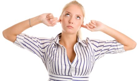 Public ‘big business discontent’ impacts how ESG and crisis communications messaging is perceived A woman plugs her fingers in her ears.