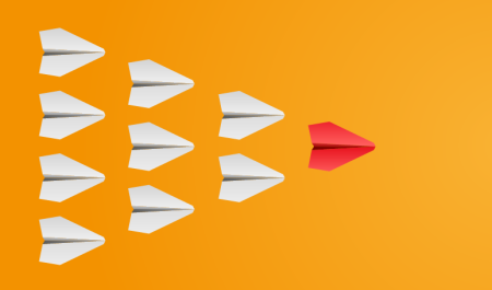 A red plane leaders a set of white planes on a bright yellow background.