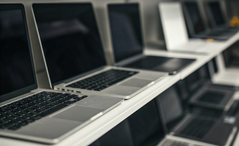 A shelf full of laptops