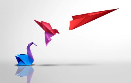 A paper swan turns into a flying bird which turns into a plane.
