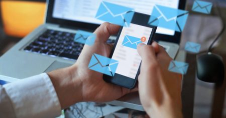 Email concept, person reading e-mail on smartphone.