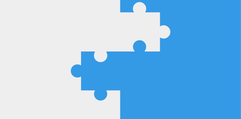 Two puzzle pieces on a divided white and blue background.