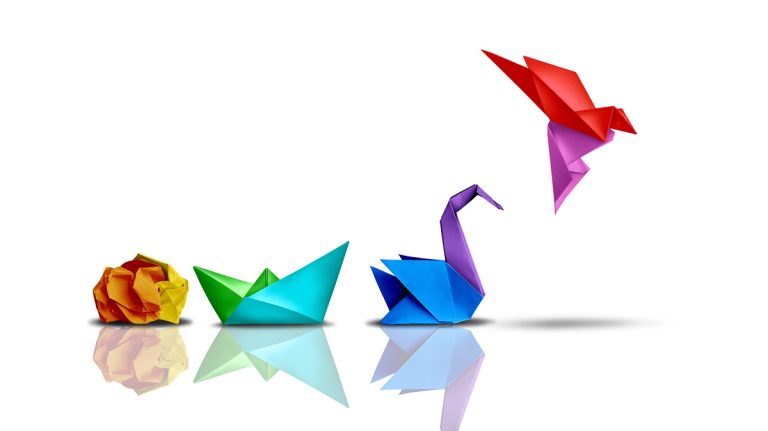 Change adoption - Resilience Forward A scrunched up ball of paper is folder into a boat, then a swan, then a bird - showing the concept of change.