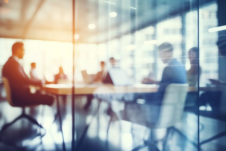 A board meeting taking place with a soft focus effect.