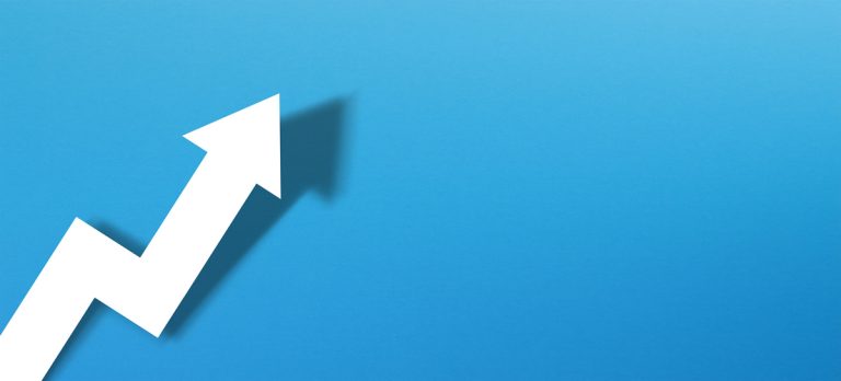 Upwards pointing white paper arrow on blue background