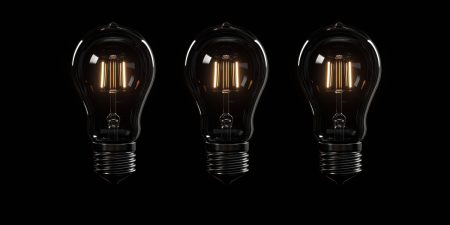 The Dark Triad in crisis management Three dark coloured light bulbs on a black background illustrate the concept of The Dark Triad in Crisis Management.