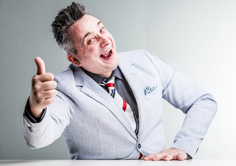 An executive gives a confident thumbs up.