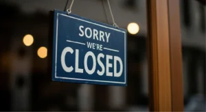 A shop door with a Sorry Closed message.