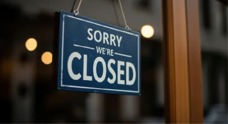 A shop door with a Sorry Closed message.