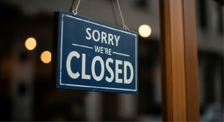 A shop door with a Sorry Closed message.