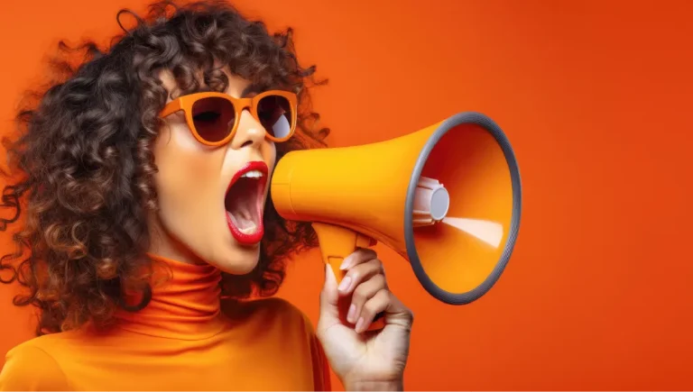 A woman shouts down a megaphone.