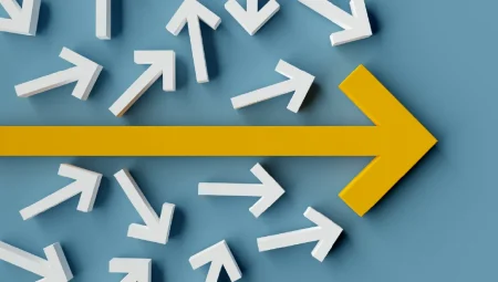 Many arrows pointing in different directions with one yellow arrow showing main direction over blue background.