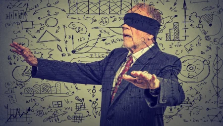A blindfolded elderly senior business man unable to see his organization's data.