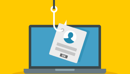 An illustration of a laptop on a yellow background. A fishing hook is being lowered to snag an ID card. Illustrating the concept of phishing.