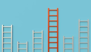 Multiple white ladders with varying heights against orange background - shows the concept of multiple capabilities.