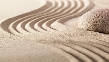 A swirl of sand around a rock to show the concept of flexibility.