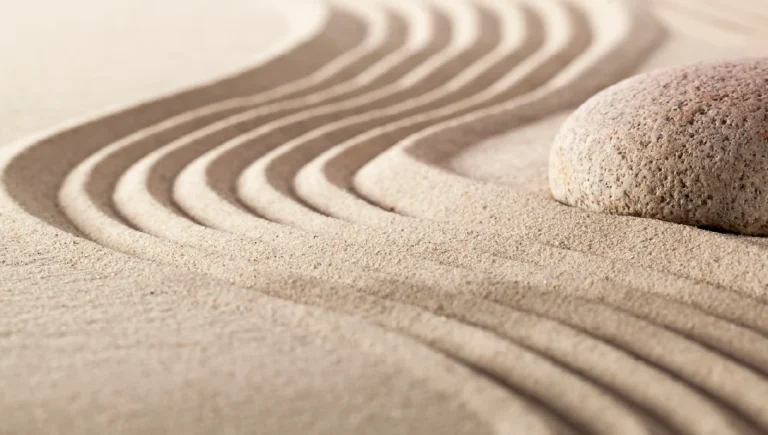 A swirl of sand around a rock to show the concept of flexibility.